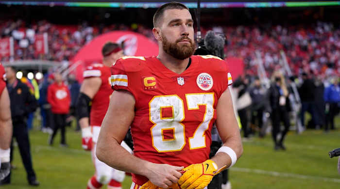Kansas City Chiefs tight end Travis Kelce walks off the field after the AFC championship NFL football game against the Cincinnati Bengals, Sunday, Jan. 30, 2022, in Kansas City, Mo. The Bengals won 27-24 in overtime